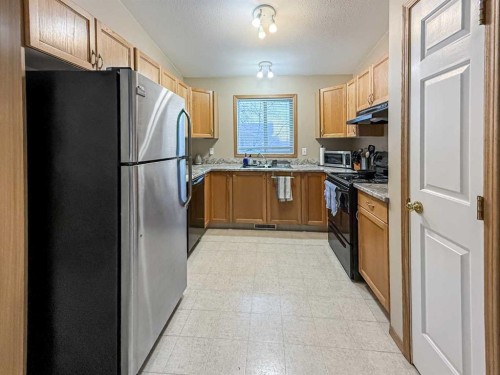 9002 63 Avenue, Grande Prairie, AB - Indoor Photo Showing Kitchen With Double Sink