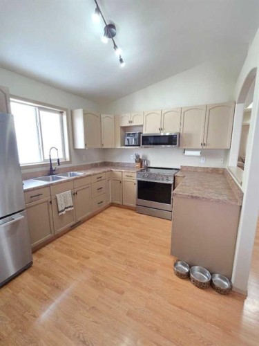 58 Pinnacle Crossing, Grande Prairie, AB - Indoor Photo Showing Kitchen With Double Sink