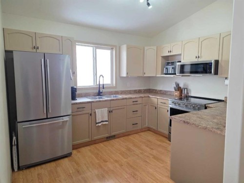 58 Pinnacle Crossing, Grande Prairie, AB - Indoor Photo Showing Kitchen With Double Sink