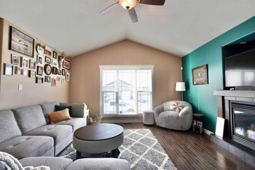 9122 130 Avenue, Peace River, AB - Indoor Photo Showing Living Room With Fireplace