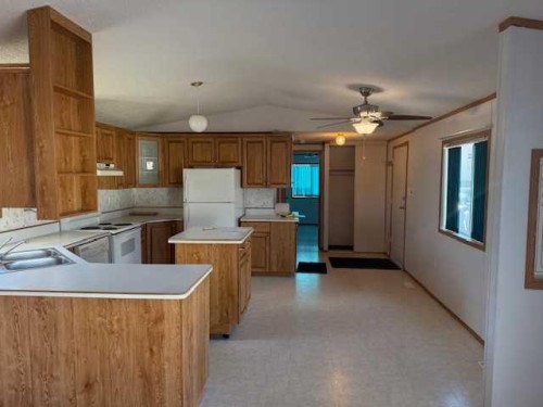 221 Mawdsley, Grande Cache, AB - Indoor Photo Showing Kitchen With Double Sink