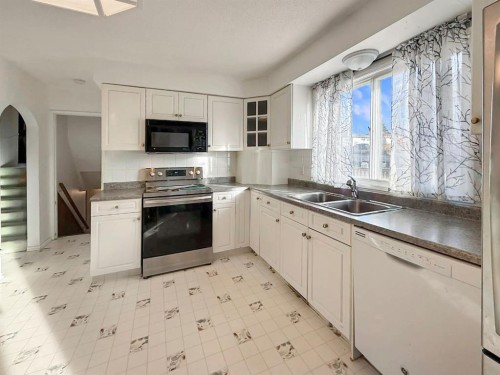 10357 99Th Avenue, Grande Cache, AB - Indoor Photo Showing Kitchen With Double Sink
