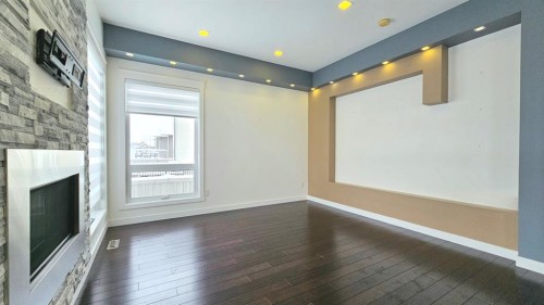 6530 Grand Banks Drive, Grande Prairie, AB - Indoor Photo Showing Other Room With Fireplace