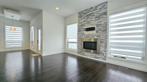 6530 Grand Banks Drive, Grande Prairie, AB - Indoor Photo Showing Living Room With Fireplace