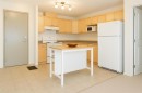210-9810 96 Street, Grande Prairie, AB  - Indoor Photo Showing Kitchen 