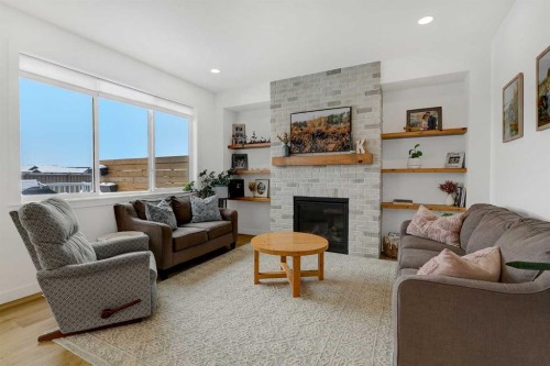 12018 83 Avenue, Grande Prairie, AB - Indoor Photo Showing Living Room With Fireplace
