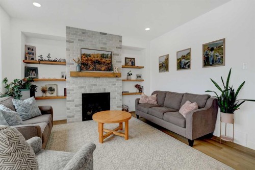 12018 83 Avenue, Grande Prairie, AB - Indoor Photo Showing Living Room With Fireplace