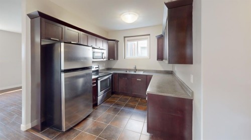 7418 115A Street, Grande Prairie, AB - Indoor Photo Showing Kitchen With Double Sink