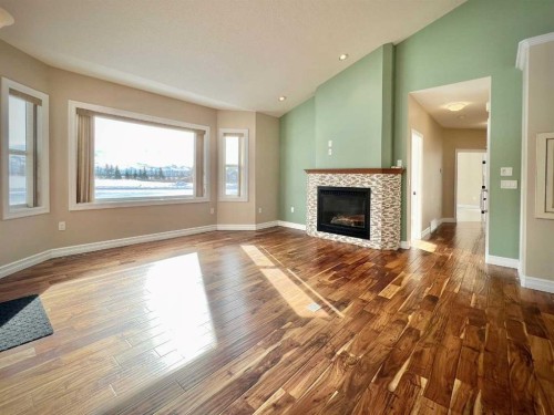 36-1049 Alberta Avenue, Debolt, AB - Indoor Photo Showing Living Room With Fireplace