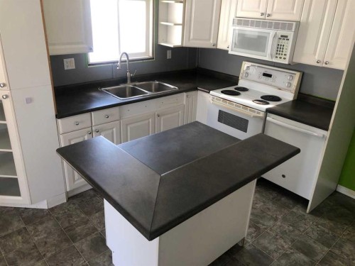 9908 105 Street, High Level, AB - Indoor Photo Showing Kitchen With Double Sink