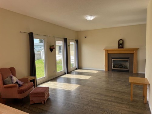 11721 103 Avenue, Fairview, AB - Indoor Photo Showing Living Room With Fireplace