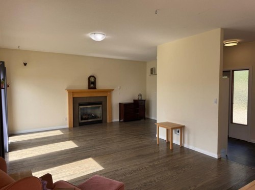 11721 103 Avenue, Fairview, AB - Indoor Photo Showing Living Room With Fireplace