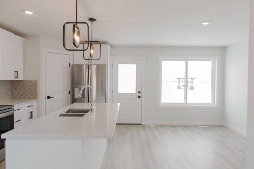 11415 95 Street, Clairmont, AB - Indoor Photo Showing Kitchen With Double Sink