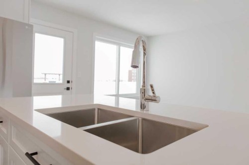 11415 95 Street, Clairmont, AB - Indoor Photo Showing Kitchen With Double Sink