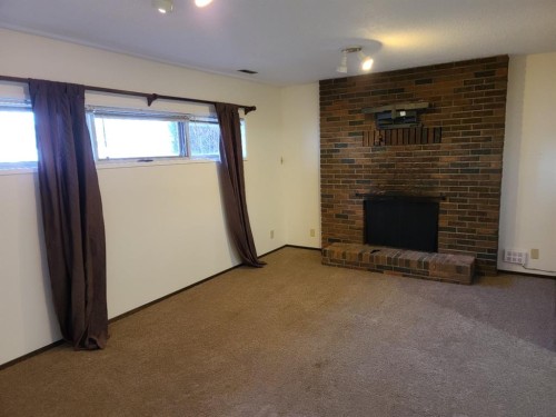 7413 96 Street, Peace River, AB - Indoor With Fireplace