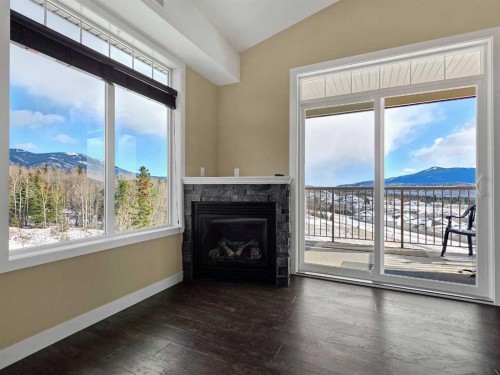 411-160 Moberly Road, Grande Cache, AB - Indoor Photo Showing Living Room With Fireplace