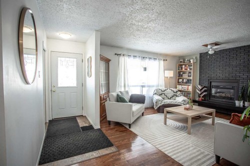 10403 106 Avenue, High Level, AB - Indoor Photo Showing Living Room With Fireplace