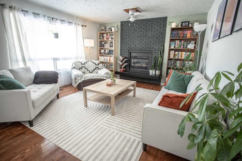 10403 106 Avenue, High Level, AB - Indoor Photo Showing Living Room With Fireplace
