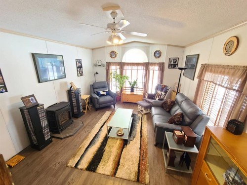 9909 80 Avenue, Peace River, AB - Indoor Photo Showing Living Room With Fireplace
