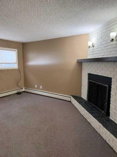 101-11114 Hoppe, Grande Cache, AB - Indoor With Fireplace