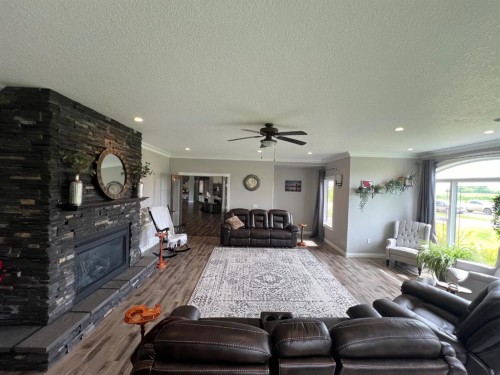 9110 100 Ave, La Crete, AB - Indoor Photo Showing Living Room With Fireplace