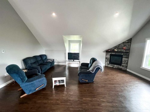 9110 100 Ave, La Crete, AB - Indoor Photo Showing Living Room With Fireplace