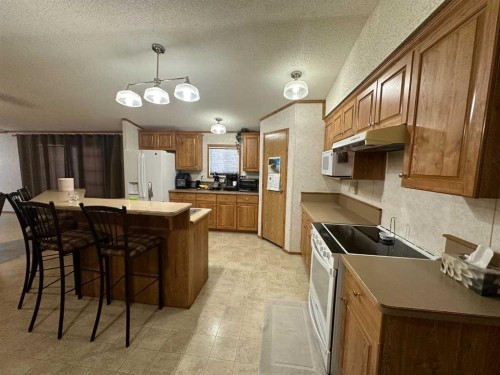 452 1St Street Sw, Falher, AB - Indoor Photo Showing Kitchen With Double Sink