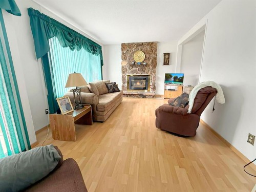 10650 104Th Avenue, Grande Cache, AB - Indoor Photo Showing Living Room With Fireplace