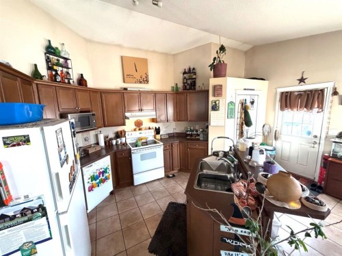 8821 Lakeland Drive, Grande Prairie, AB - Indoor Photo Showing Kitchen With Double Sink