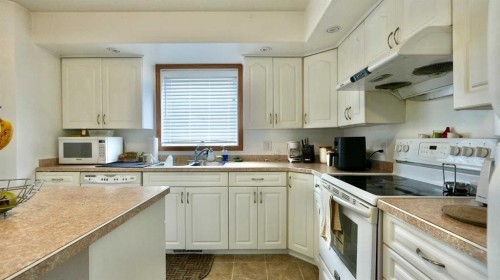 10302 83 Street, Peace River, AB - Indoor Photo Showing Kitchen With Double Sink