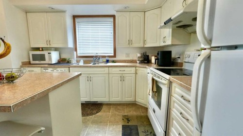10302 83 Street, Peace River, AB - Indoor Photo Showing Kitchen With Double Sink