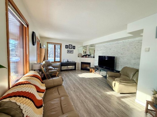 9202 95 Ave, La Crete, AB - Indoor Photo Showing Living Room With Fireplace