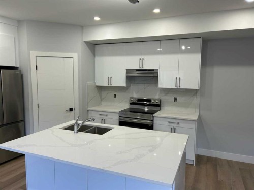9313 103 Avenue, Grande Prairie, AB - Indoor Photo Showing Kitchen With Double Sink With Upgraded Kitchen