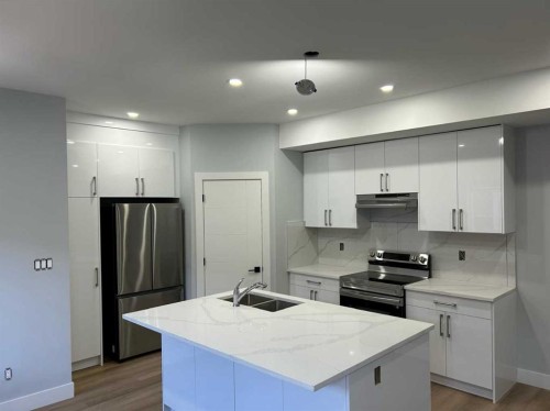 9313 103 Avenue, Grande Prairie, AB - Indoor Photo Showing Kitchen With Double Sink With Upgraded Kitchen