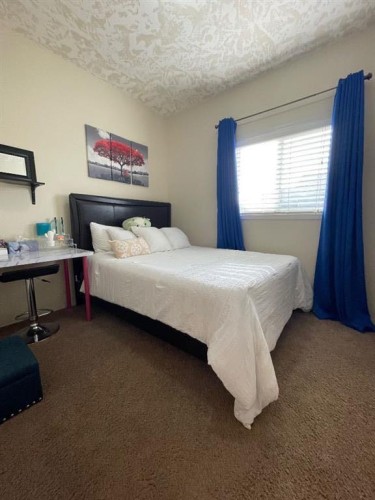 5069 Cornerstone, High Prairie, AB - Indoor Photo Showing Bedroom