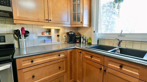 9610 77 Avenue, Peace River, AB - Indoor Photo Showing Kitchen With Double Sink