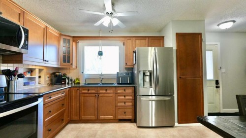 9610 77 Avenue, Peace River, AB - Indoor Photo Showing Kitchen With Double Sink