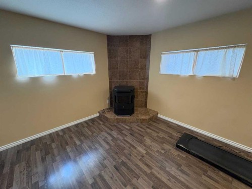 9117 134 Avenue, Peace River, AB - Indoor Photo Showing Other Room With Fireplace