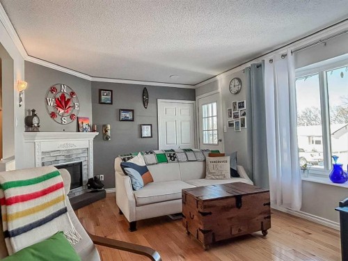 4806 53 Avenue, Valleyview, AB - Indoor Photo Showing Living Room With Fireplace