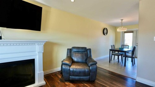 7901 94 Street, Peace River, AB - Indoor Photo Showing Living Room With Fireplace