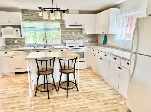 107 Central Avenue S.W., Falher, AB - Indoor Photo Showing Kitchen With Double Sink