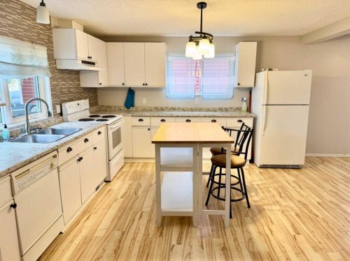 107 Central Avenue S.W., Falher, AB - Indoor Photo Showing Kitchen With Double Sink