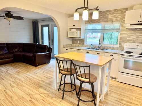 107 Central Avenue S.W., Falher, AB - Indoor Photo Showing Kitchen With Double Sink