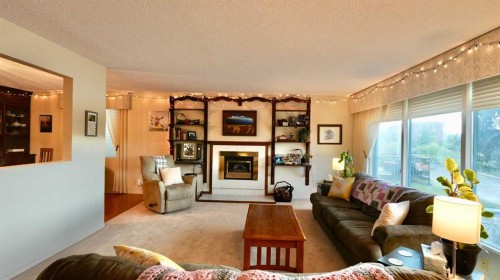 11113 103 Street, Peace River, AB - Indoor Photo Showing Living Room With Fireplace
