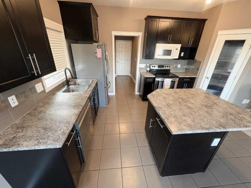 9510 Willow Drive, Grande Prairie, AB - Indoor Photo Showing Kitchen With Double Sink