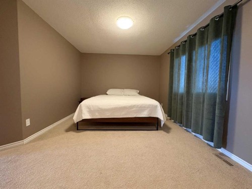 9510 Willow Drive, Grande Prairie, AB - Indoor Photo Showing Bedroom