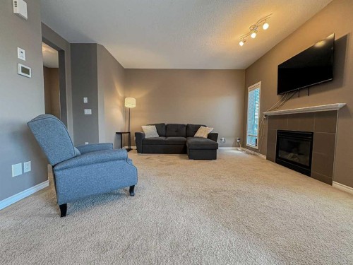 9510 Willow Drive, Grande Prairie, AB - Indoor Photo Showing Living Room With Fireplace