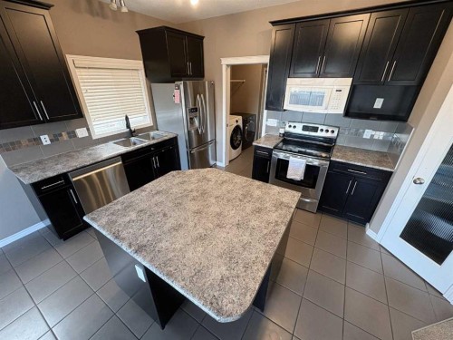 9510 Willow Drive, Grande Prairie, AB - Indoor Photo Showing Kitchen With Stainless Steel Kitchen With Double Sink With Upgraded Kitchen