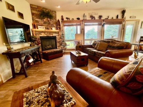 155 Peace River Avenue, Joussard, AB - Indoor Photo Showing Living Room With Fireplace
