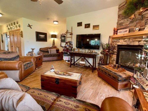 155 Peace River Avenue, Joussard, AB - Indoor Photo Showing Living Room With Fireplace